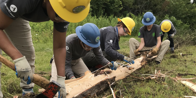 SECC Women's crew chops up a log