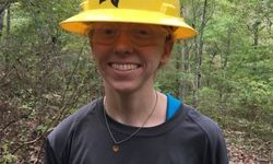 Crewmember Caitlin Smiling With Mud On Her Face