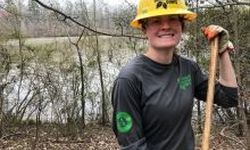 Kelsey On The Project Site Holding A Mc Loed