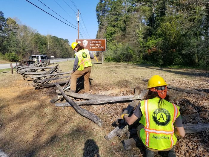 AmeriCorps-Members-working-on-fencing-at-Cowpens-National-Battlefield-with-park-sign-in-battlefield.jpg#asset:493