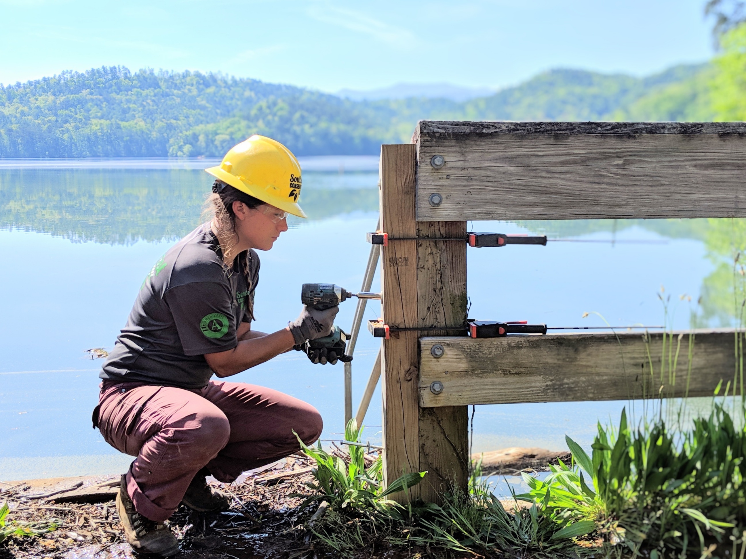 Americorps-Crewmember-drilling-into-a-fence.jpg#asset:500